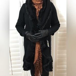 A beautiful deep black faux trimmed knee length or above dressy sweater.